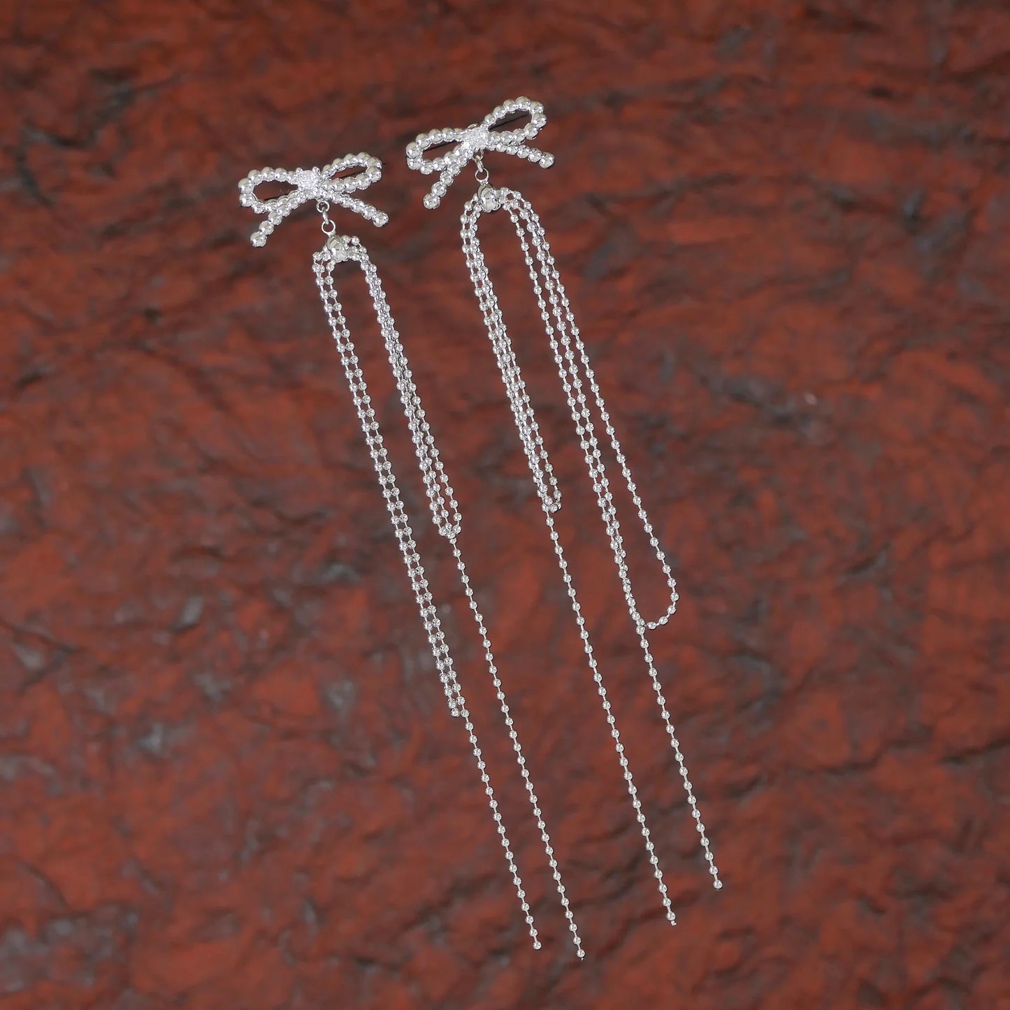 Twinkle Tails – Silver Bow Chain Earrings
