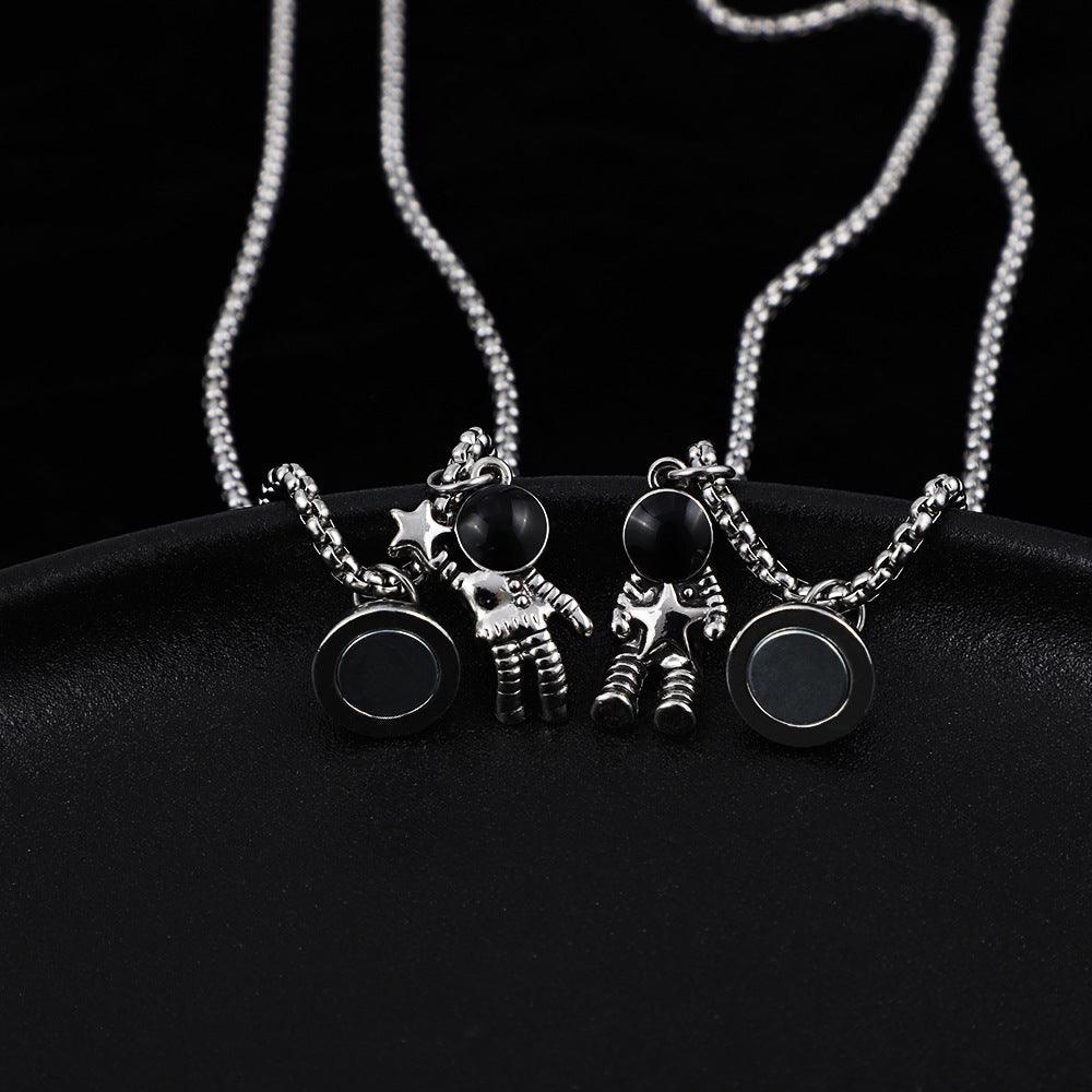 Cosmic Bond – Dual Astronaut Pendant Set
