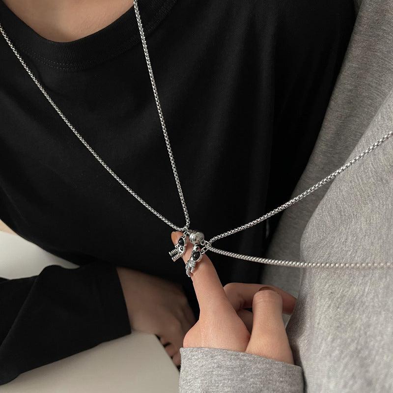 Cosmic Bond – Dual Astronaut Pendant Set