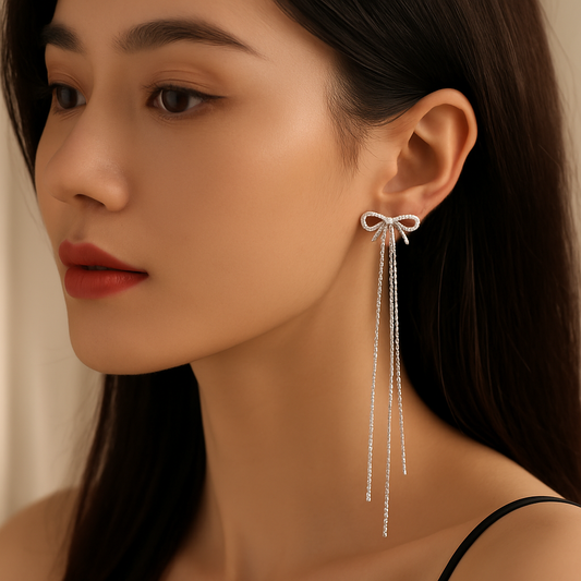 Twinkle Tails – Silver Bow Chain Earrings