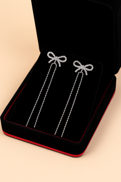 Twinkle Tails – Silver Bow Chain Earrings