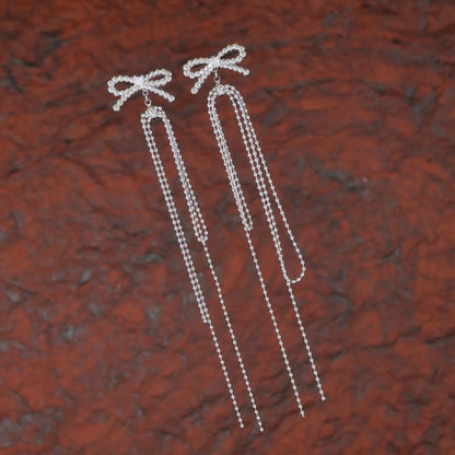 Twinkle Tails – Silver Bow Chain Earrings