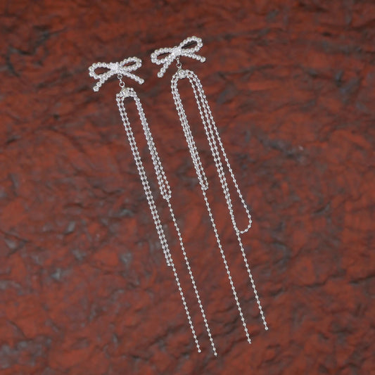 Twinkle Tails – Silver Bow Chain Earrings